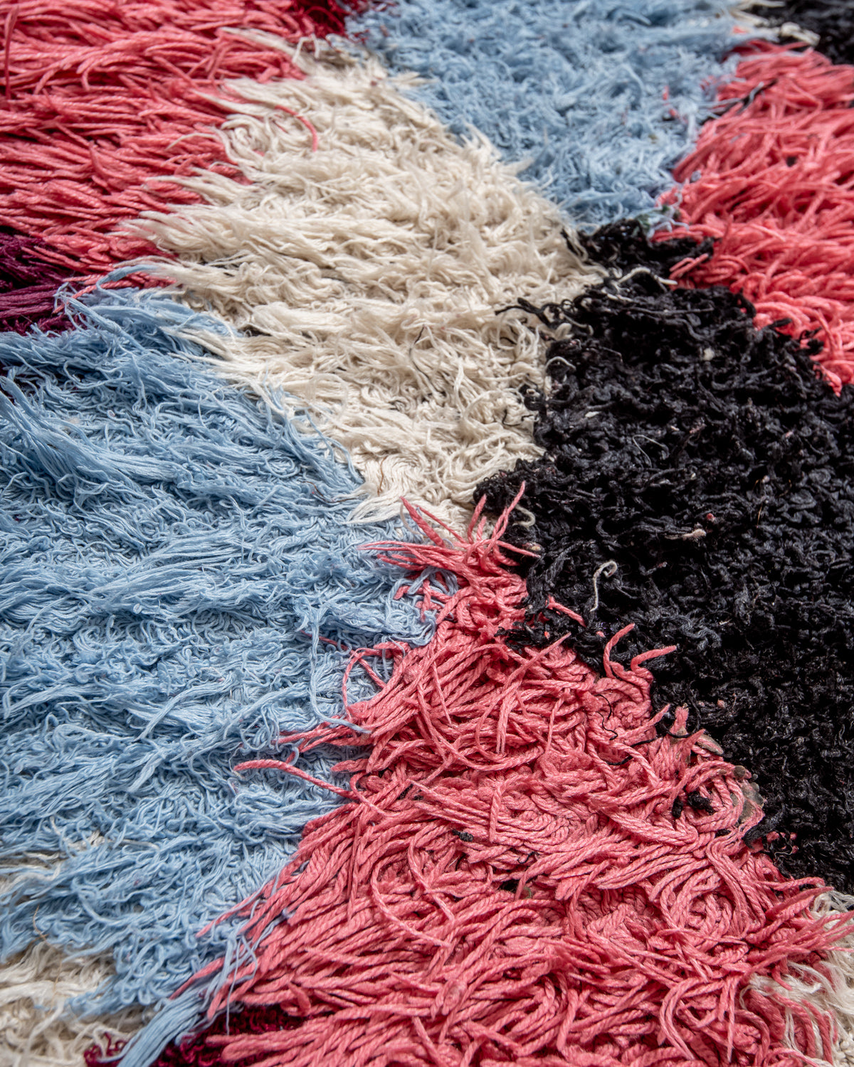 Modern designer vintage handcrafted Berber rug from Morocco. Boucherouite runner rug with beautiful colors and patterns.